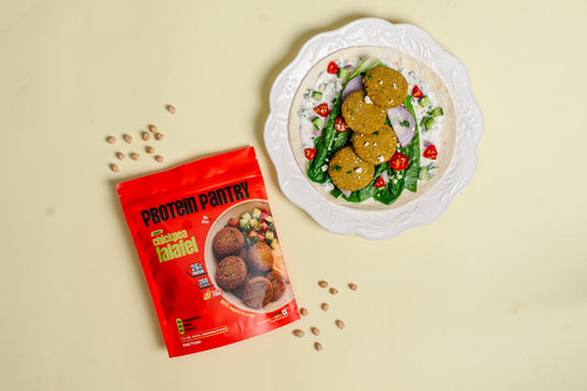 A Packet of Protein Pantry Chickpea Falafel High-Protein Tikki and a Plate of Said Item with Dressing